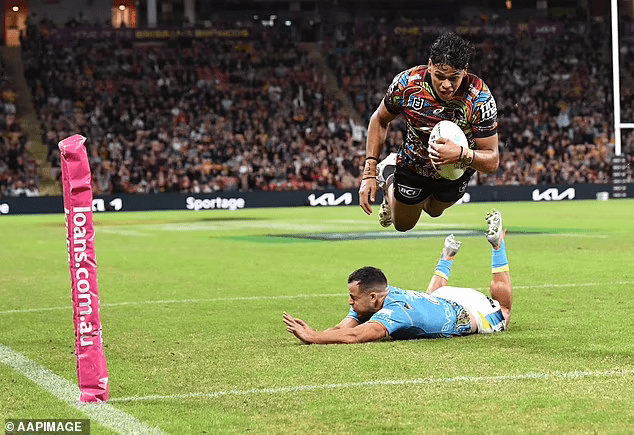 58577171-10877451-Selwyn_Cobbo_scores_a_spectacular_try_for_the_Broncos_in_Round_1-a-1_1654150...png